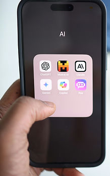 a person holding a cell phone in their hand_edited.jpg