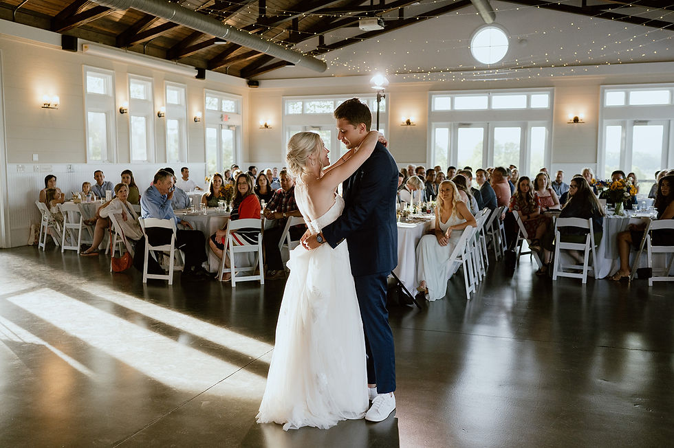 bride and groom sharing a moment during their first dance in the modern and timeless event center during their reception