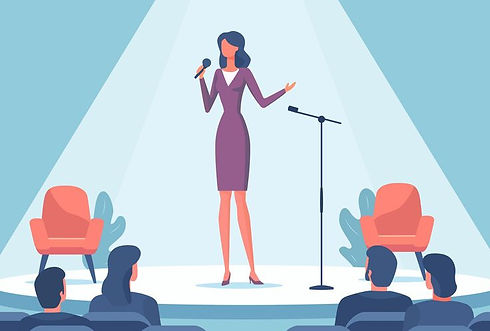 Woman performing on stage in front of audience_ Business event.jpeg