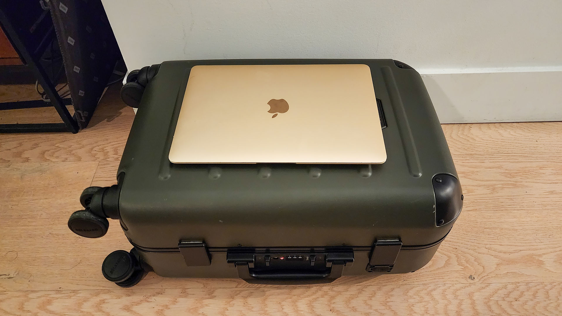 Size comparison between a 12 inch MacBook Air and the small Solgaard carry-on closet in Best carry-on in 2024, Away, Solgaard, Beis, Monos. Best travel blog. best blog. Luxury travel blog. 