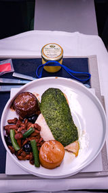 Main course chicken Business class seat Air France A350 with full recline lay flat seat and extra legroom. Luxury flight. Luxury Travel Blog.