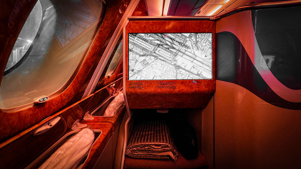 Large in flight entertainment screen and foot rest with lots of space on Emirates A380 in Business Class. Flight review. Luxury travel. First Class. Best travel blog.