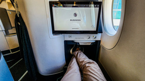 Foot rest on Business class seat Air France A350 with full recline lay flat seat and extra legroom. Luxury flight. Luxury Travel Blog.