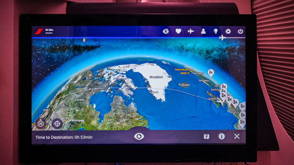 Large entertainment screen with the flight map Business class seat Air France A350 with full recline lay flat seat and extra legroom. Luxury flight. Luxury Travel Blog.