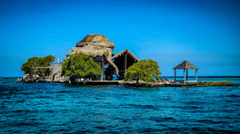 Thatched roof houses on islands from a private boat from Las Islas Baru, Rosario Islands, Cartagena, Colombia, Luxury hotel, luxury resort, luxury blog, travel blog, hotel review.