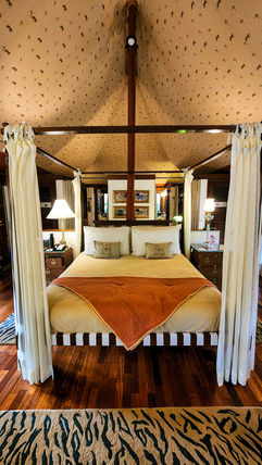 Bed inside luxury tent at Oberoi Vanyavilas hotel in Ranthambore, India, on Elegant Escape, the best luxury Travel Blog.
