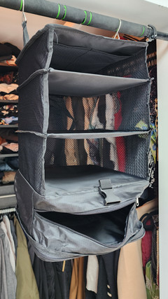An open empty small travel packing closet from the side