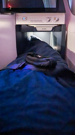 Sleeping in Business class seat Air France A350 with full recline lay flat seat and extra legroom. Luxury flight. Luxury Travel Blog.