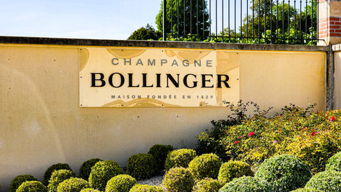 Champagne Bollinger sign in the parking lot at the tasting Champagne tour of Champagne Bollinger in Champagne France. Luxury Wine Travel Blog.
