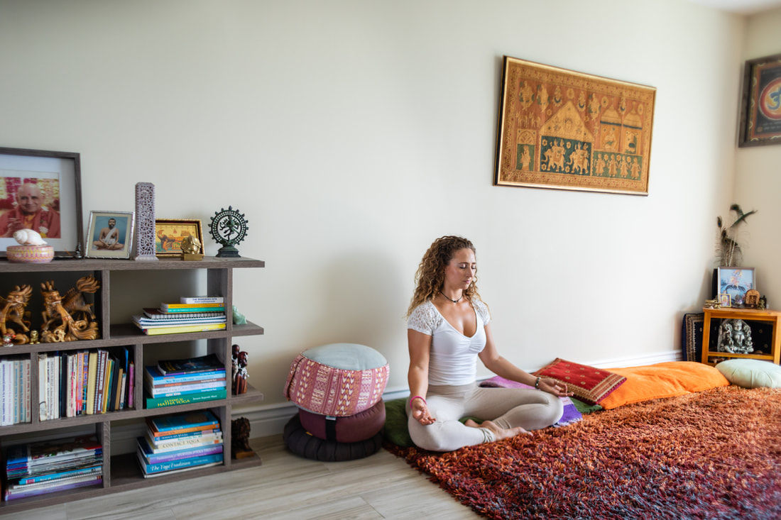 Person meditating in the SKYLIGHT YOGA Ashram Miami Beach Florida