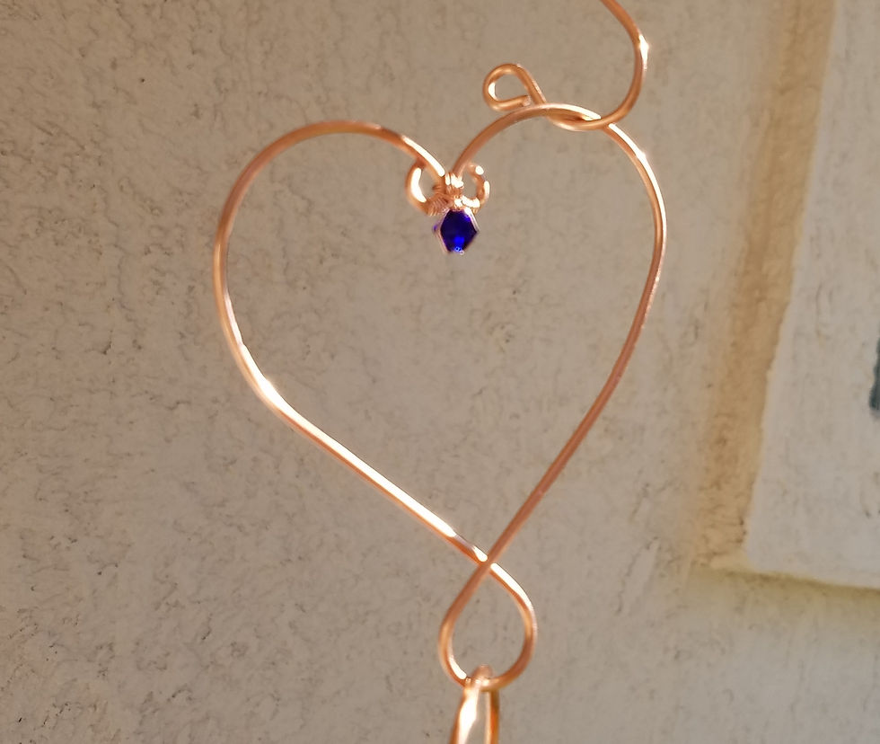Thumbnail: Heart Links are used to add length and color to Hummingbird Feeders and Yard Art
