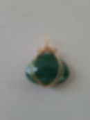 A Beautiful Green Faceted Aventurine Stone hand wrapped in Twisted Brass Wire.