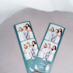 Two teal photo strips with smiling faces resting on a soft light background.
