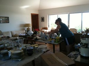 Paxem employee sorting household items