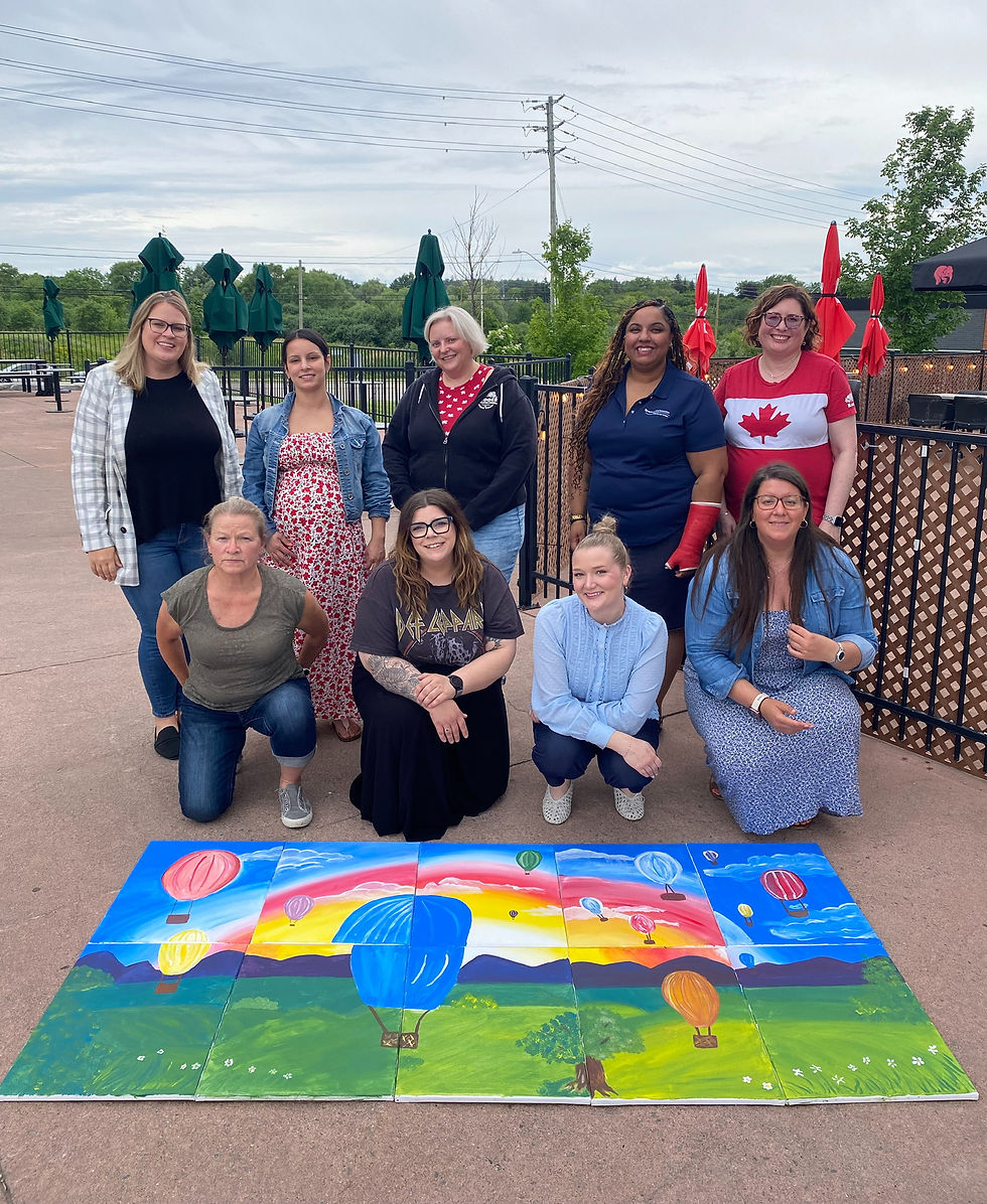Team behind their collaborative canvas paintings