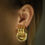 Thumbnail: Classic knots shape gold tone earrings