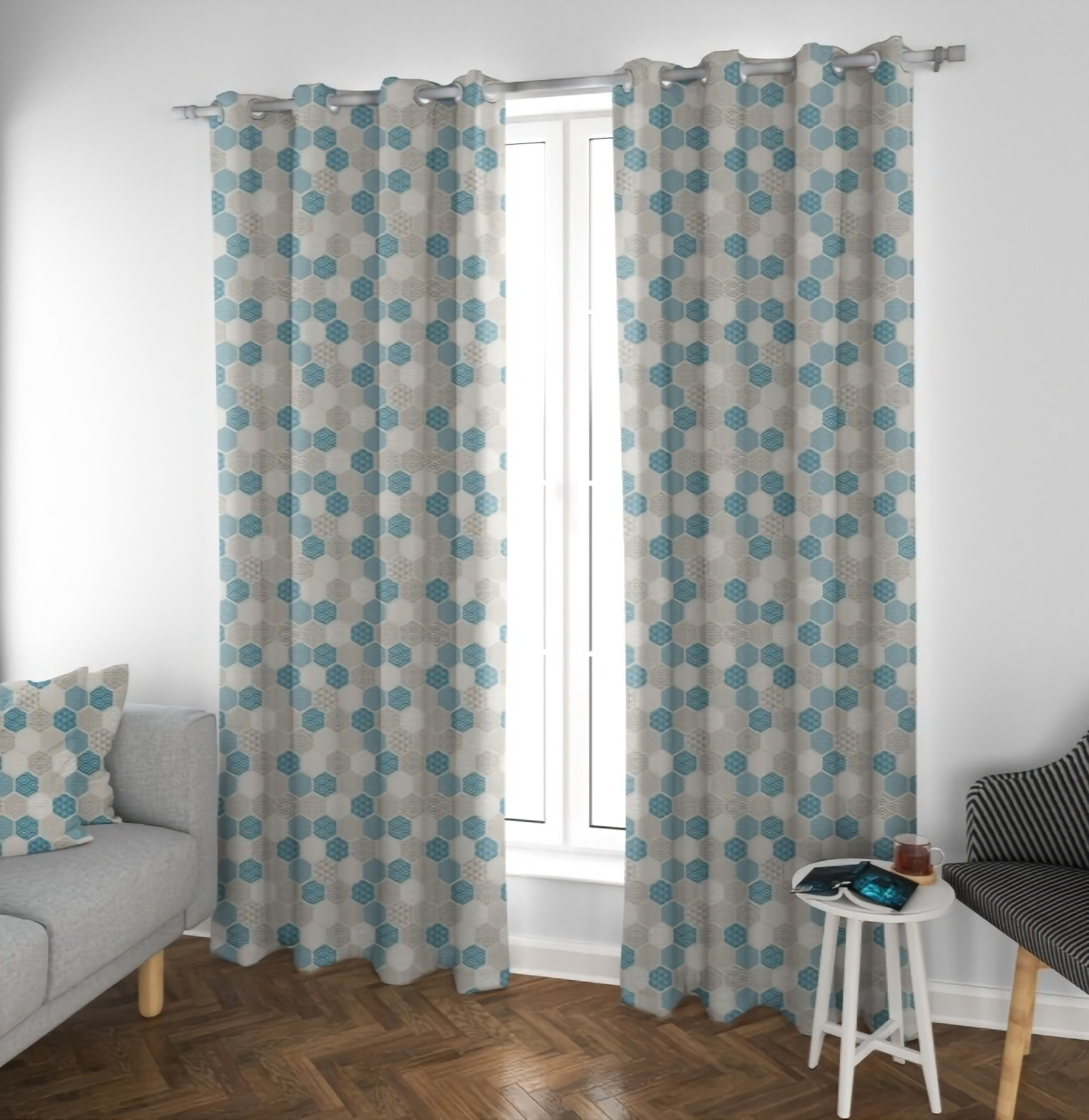 Blue Hex Pair of Curtains by Touch of Class hanging in front of window