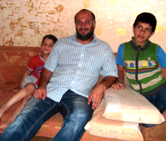 Moti with two war-orphans form Syria.