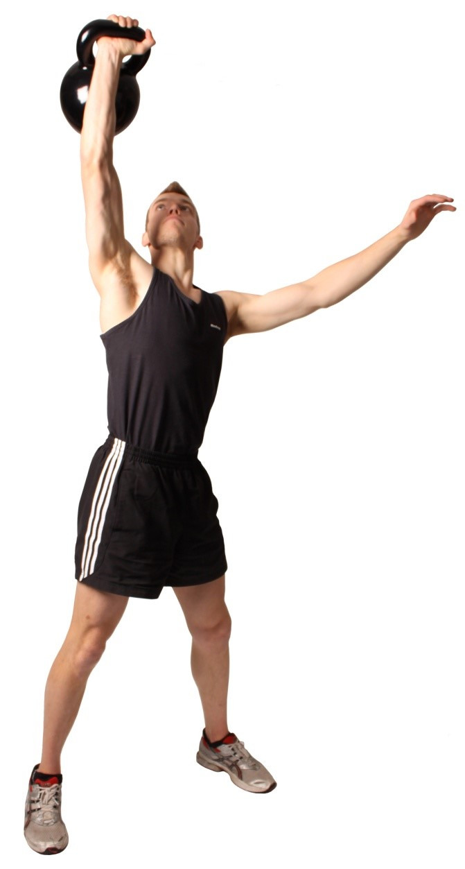 a man performing the kettlebell press
