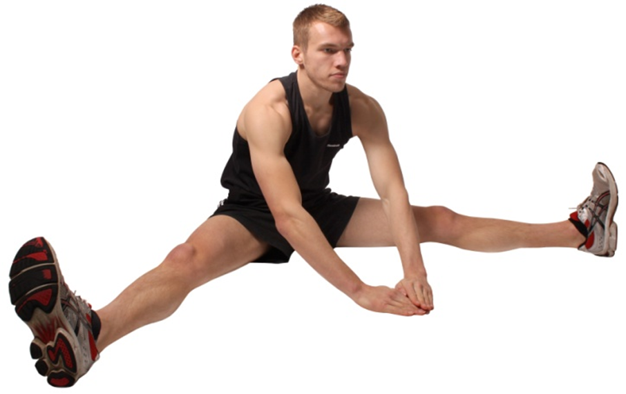 A man performing a groin stretch.