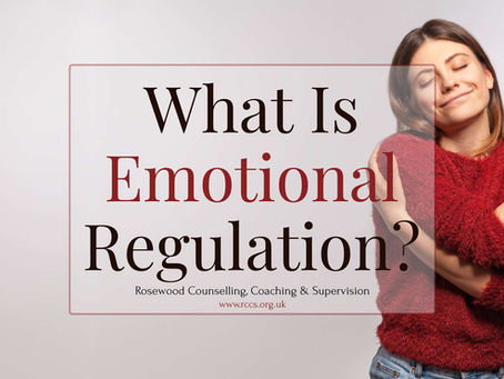 A woman hugging herself demonstrating what is emotional regulation.