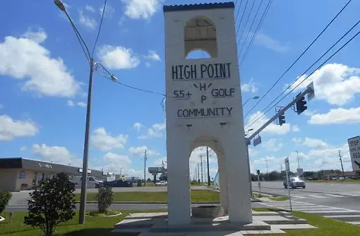 High Point 55+ golf community entrance tower sign in Brooksville, Florida.
