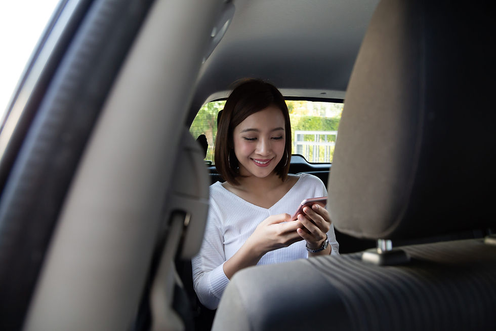 woman-using-smartphone-in-car-scaled.jpg