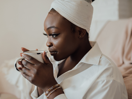 A black woman with a mug.
