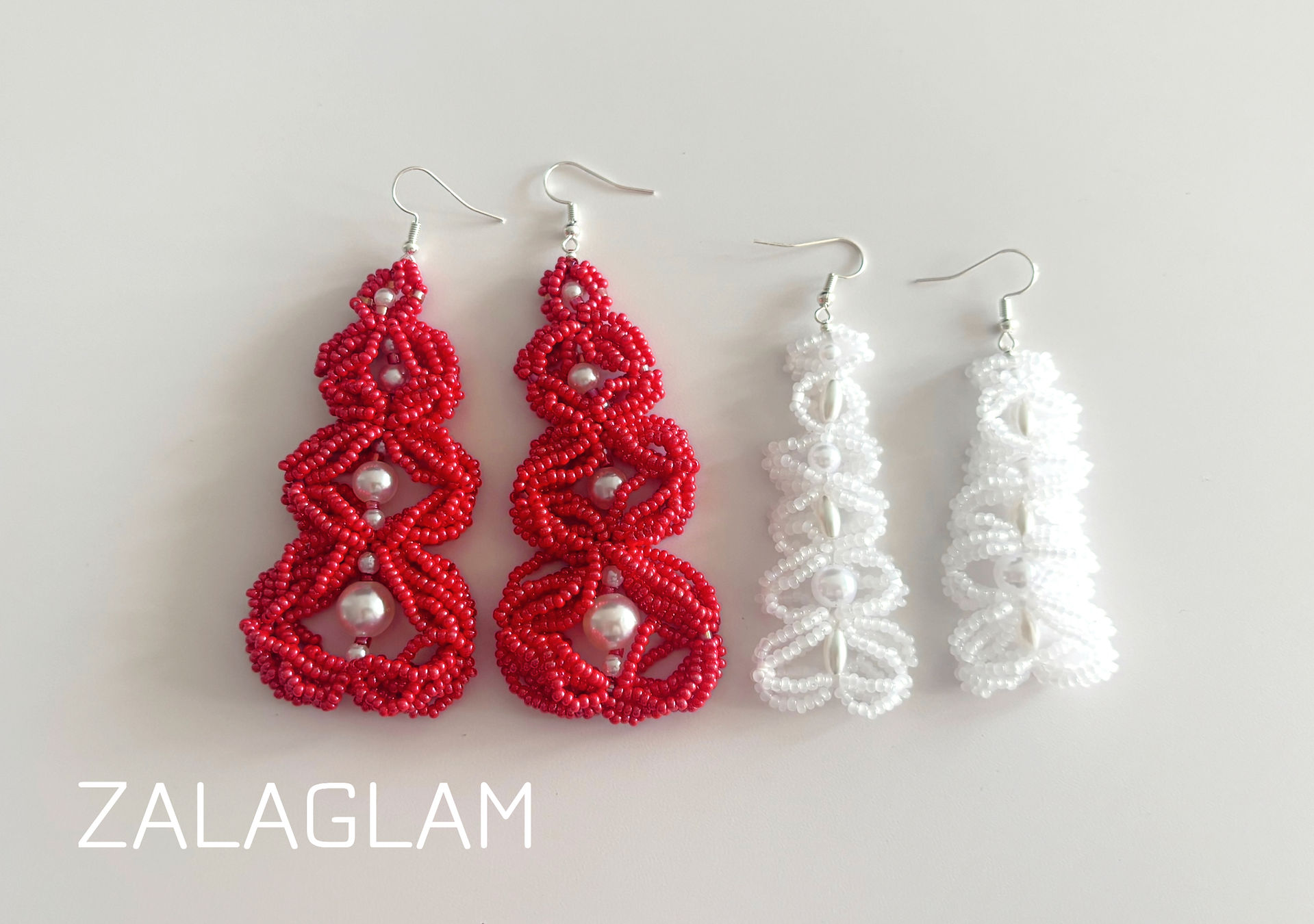 The mellow red beaded earrings and the filigree white beaded earrings