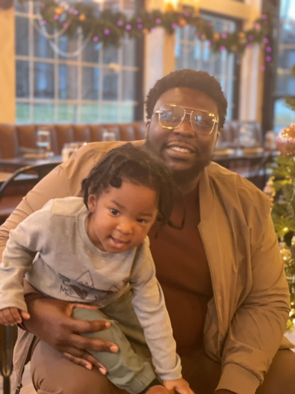 Celebrating w/ Uncle John & baby Lucas