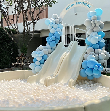 Double party slide decorated with white and blue balloons