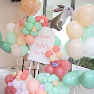 Baby shower balloon decoration with pastel garland and welcome sign