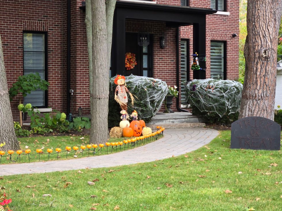 Halloween Decorations with scarecrow and pumpkins