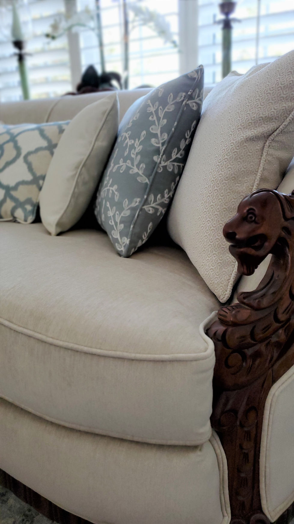 Reupholstery of antique sofa with custom toss pillows