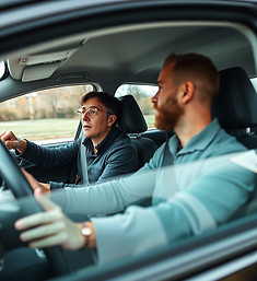 a learner driver in a car with a instructor.jpg