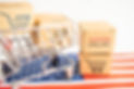vecteezy_box-with-shopping-online-cart-logo-and-usa-america-flag_8316782.jpg