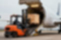 vecteezy_forklift-operator-unloading-wooden-crate-from-cargo-airplane_74597710.jpg