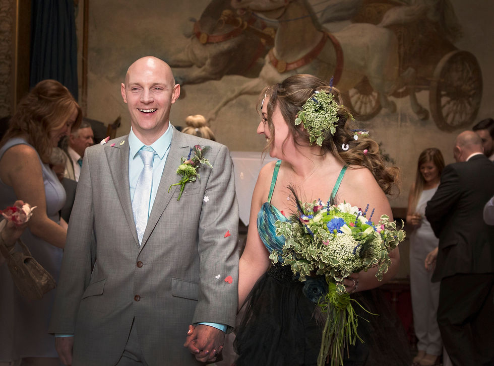 Sian Jackson Humanist Wedding Celebrant walking down the aisle hand in hand with her husband about to marry him