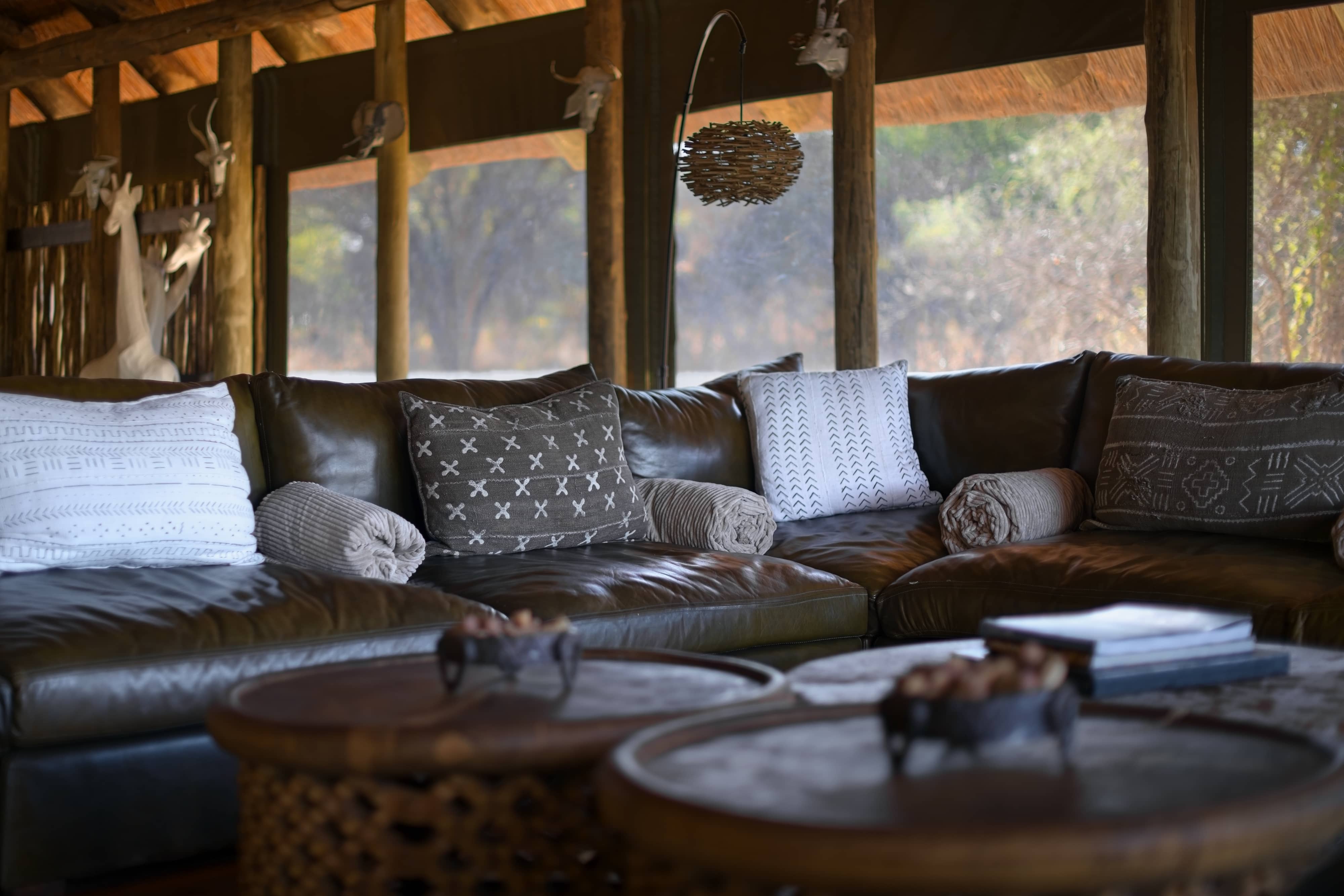 Mogotlho Safari Lodge leather couch and african fabric cushions photographed by Kai