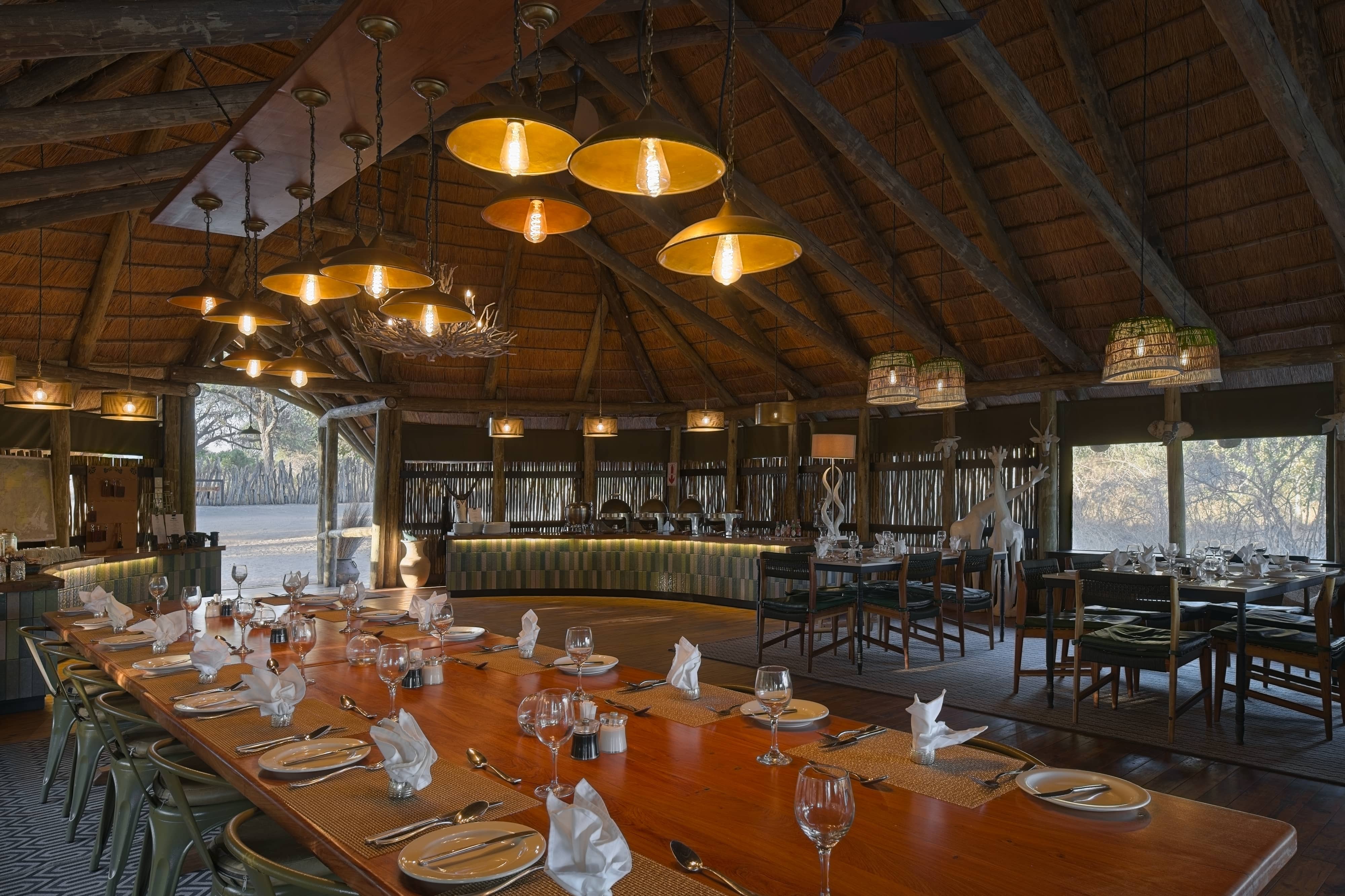 Mogotlho Safari Lodge photo of dining and serving with reed roof and tented sides