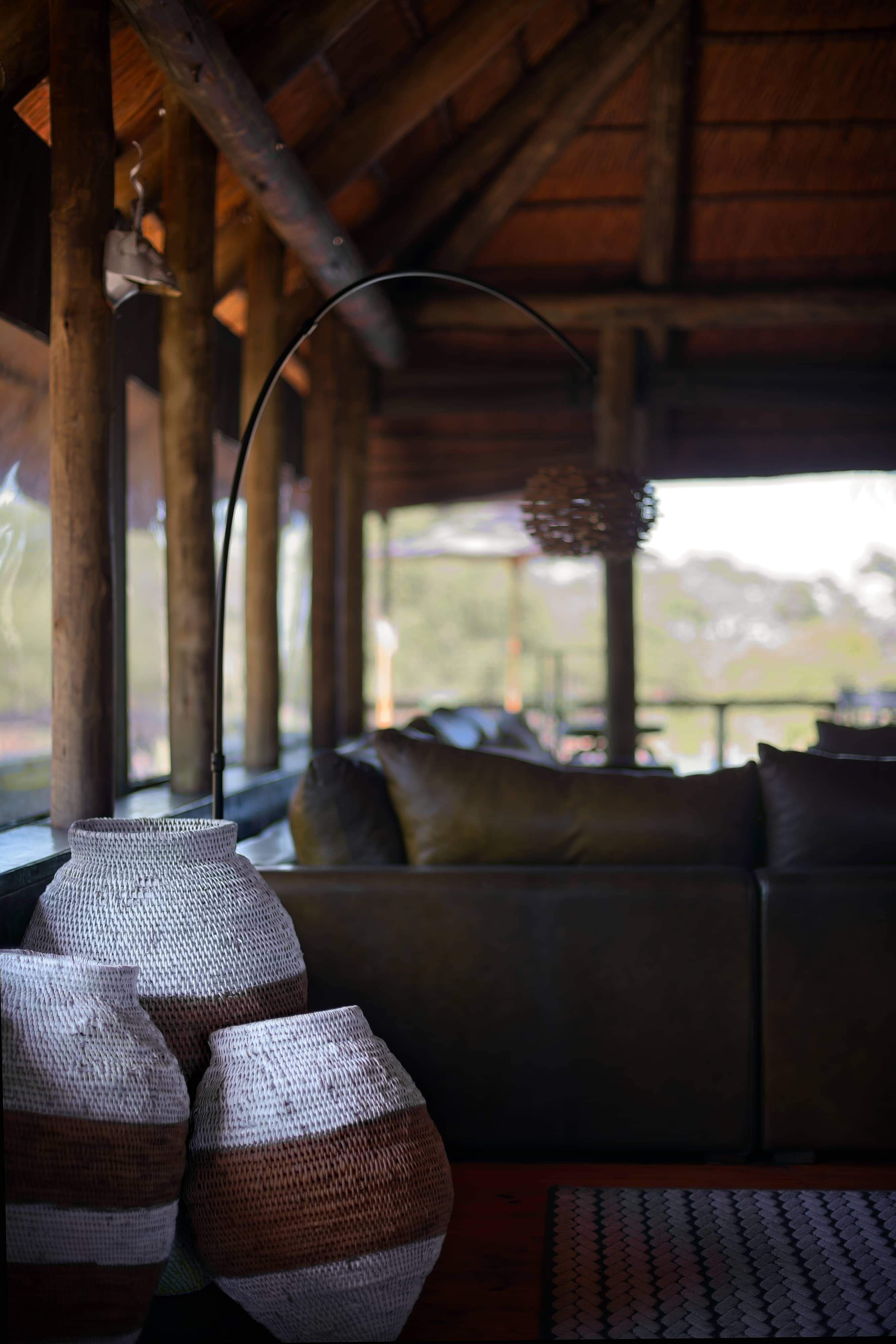 Mogotlho Safari Lodge decorated with woven baskets in the lounge and photographed to show the baskets