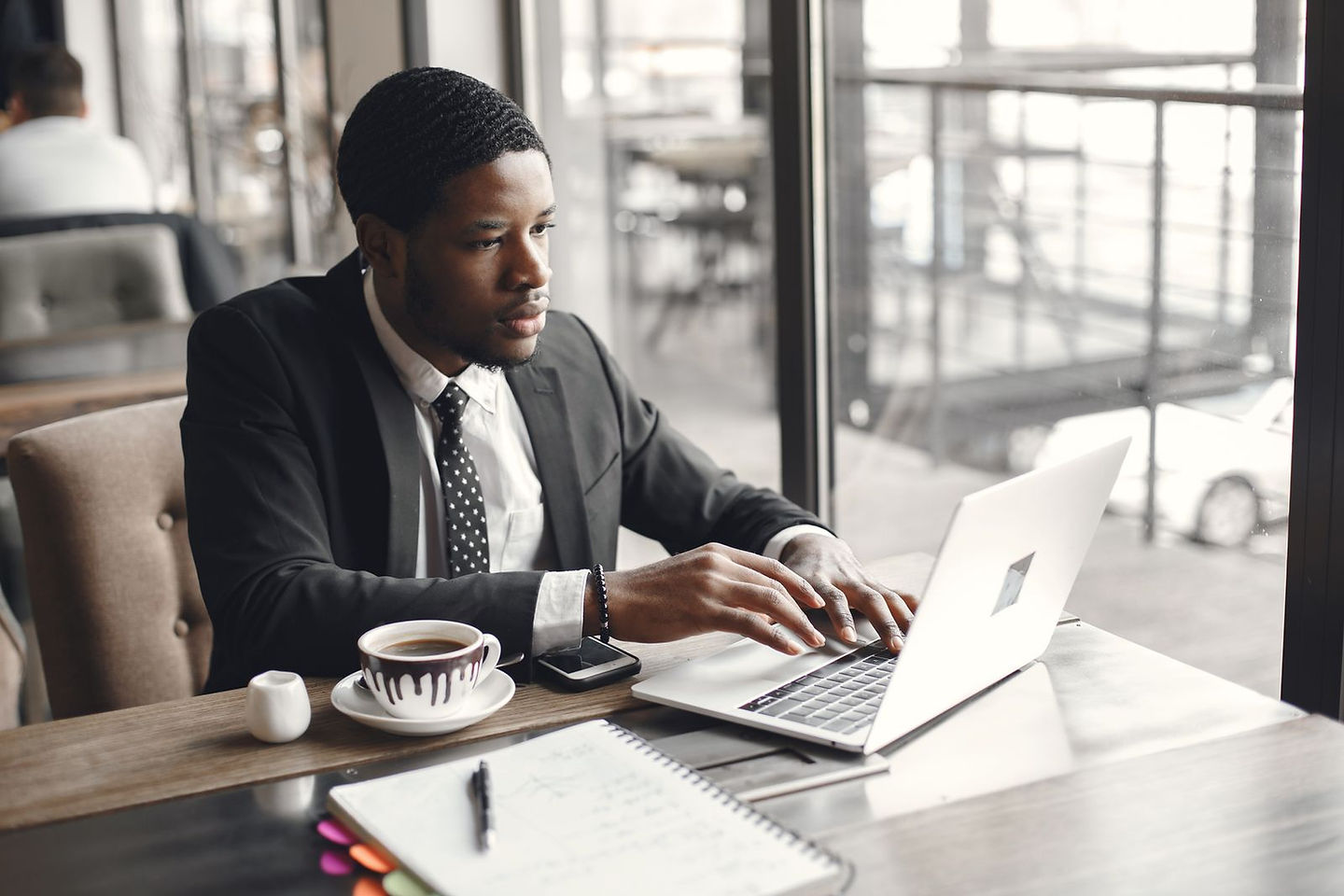 Freelancer reviewing business finances on a laptop as a Mint replacement