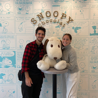 A couple posing with Snoopy doll inside the Snoopy Chocolat shop located in Kyoto