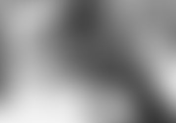 Two men drink from segregated water fountains.