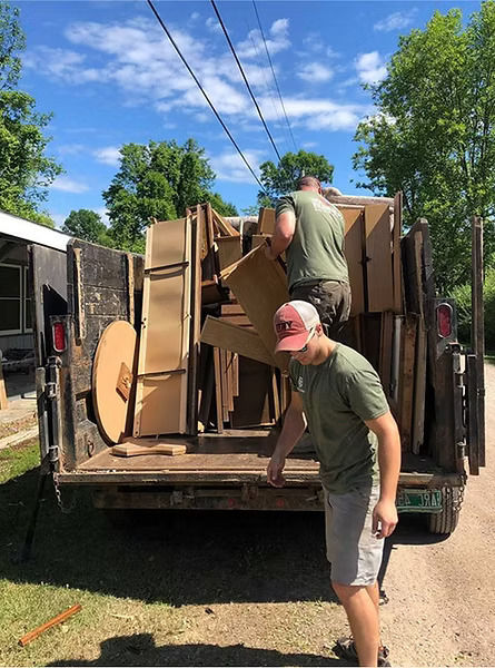 Michael's Junk Removal crew loading a truck in Louisville, KY