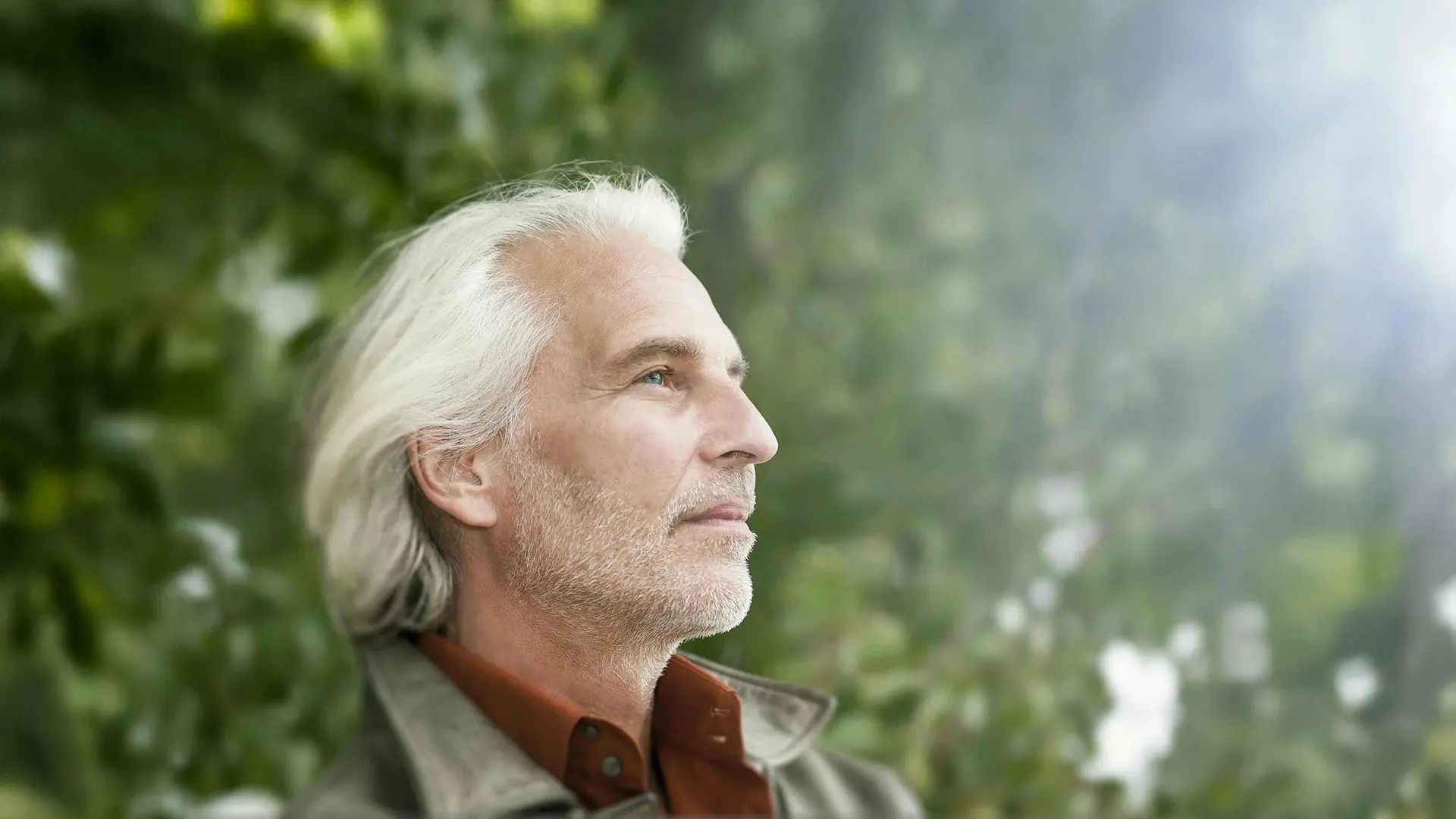 Mature man outdoors with healthy skin representing men’s anti-aging treatments in NYC