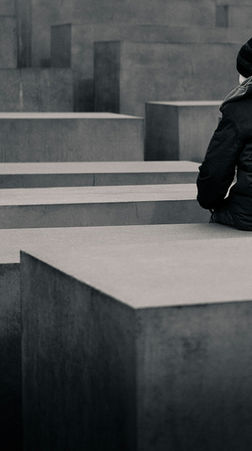 Person sitting alone lost in thought, illustrating overthinking and preparing for conversations that haven't happened.