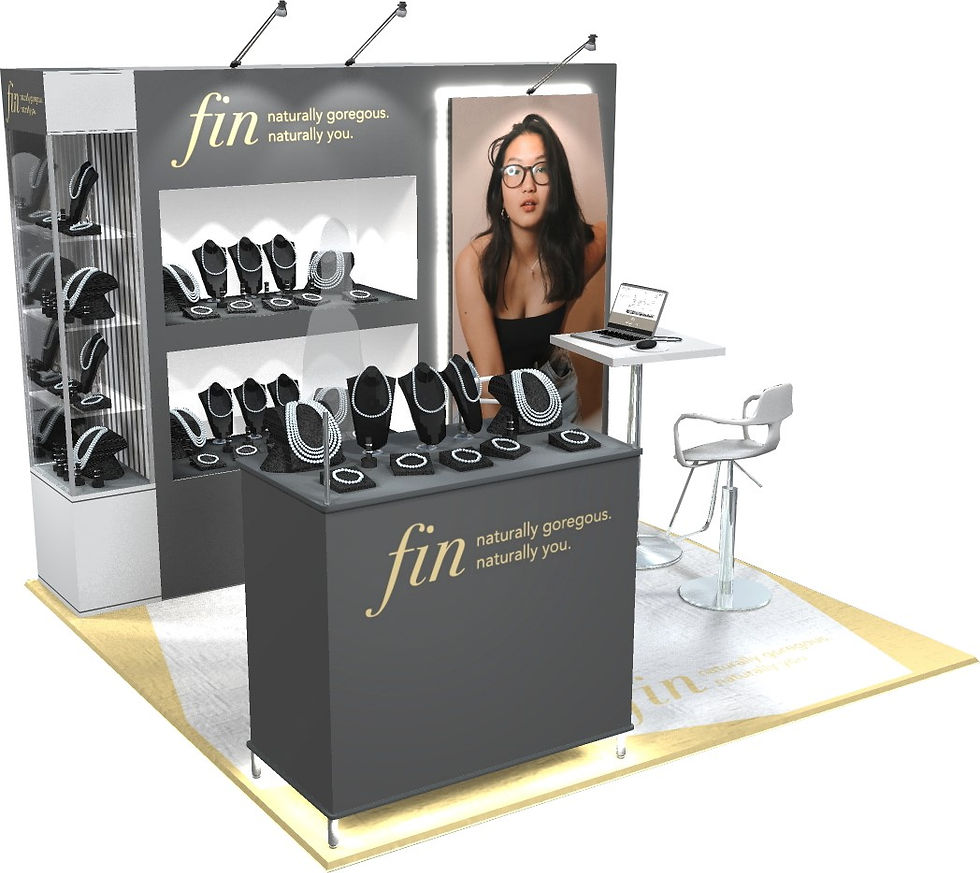 Custom jewelry trade show exhibit for fin featuring illuminated display cases, branded counter, seating area, and product showcases