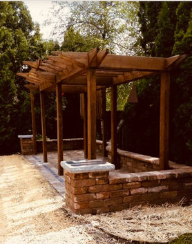 Enticing pergola covering a stone patio. Designed and installed by Marvin's Brick Pavers in Madison, WI.