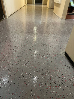 Resilient epoxy flooring in a high-traffic hallway - Marvin's Brick Pavers, Madison, WI
